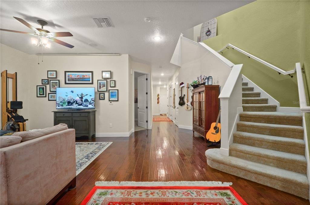 From the lower level front door, up the stairs to the kitchen, family room, primary bedroom and porch.