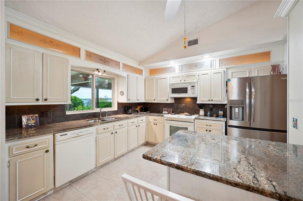 Kitchen also enjoys view out to lake