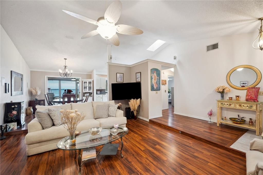 Living Room looking to Dining Room and lake views beyond