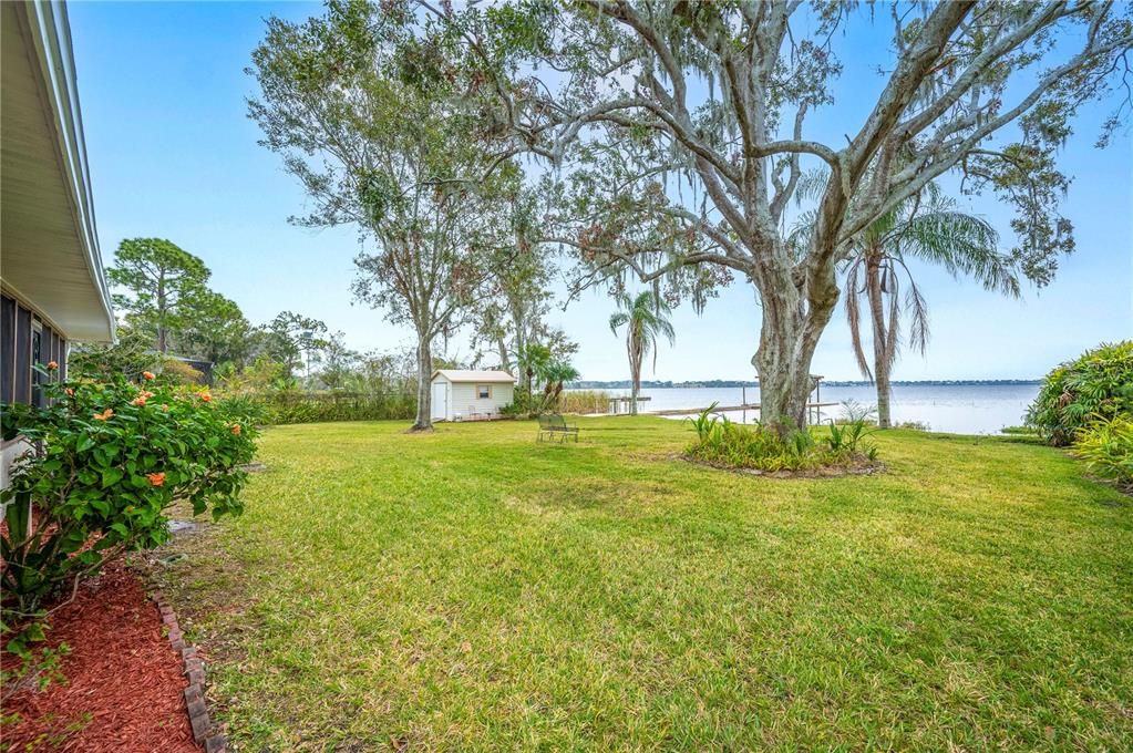 Palm trees and tropical landscaping enhance the beauty of this beautiful property