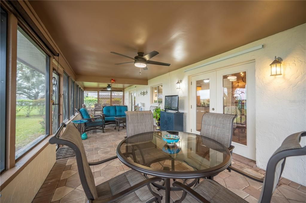 Plenty of room for entertaining on the back screened lanai - French Doors lead to Dining Rom and Kitchen