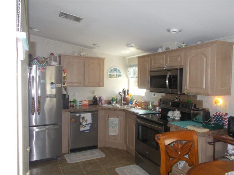 Kitchen featuring stainless corner sink