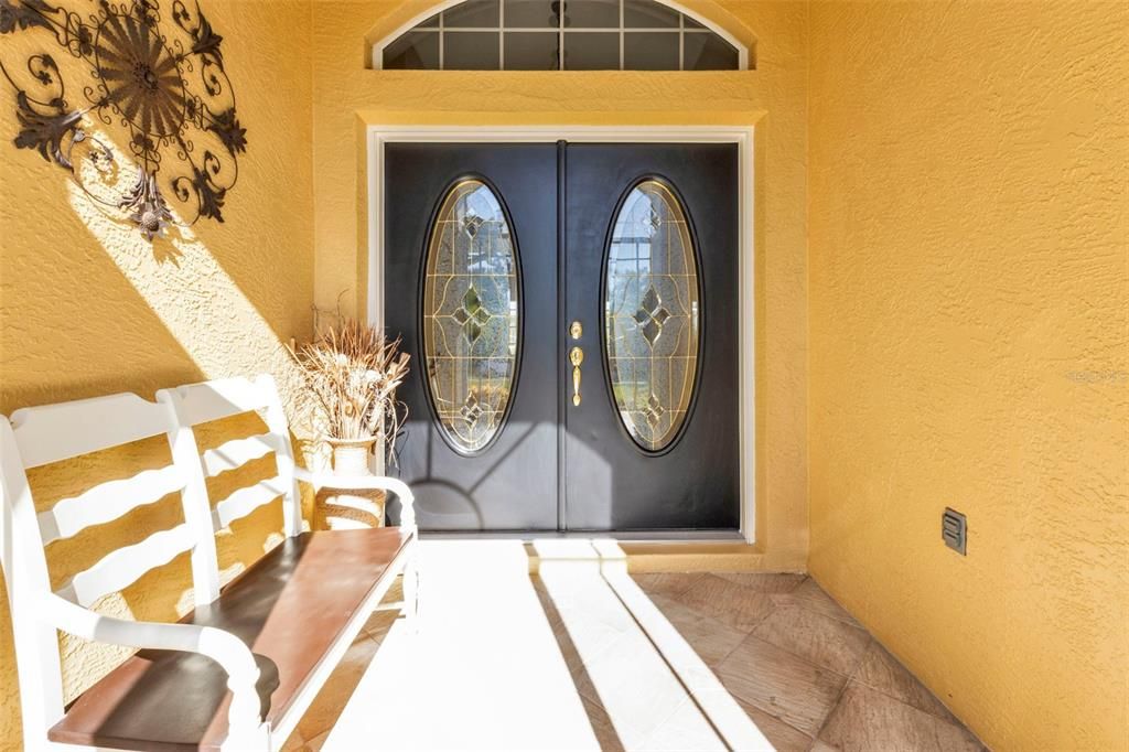 Large front porch with nice glass paned double front entry doors!