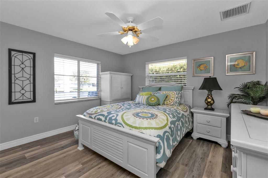 Bedroom 2 with luxury vinyl flooring and large reach in closet.