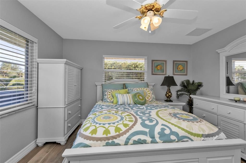 Bedroom 2 with luxury vinyl flooring and large reach in closet.