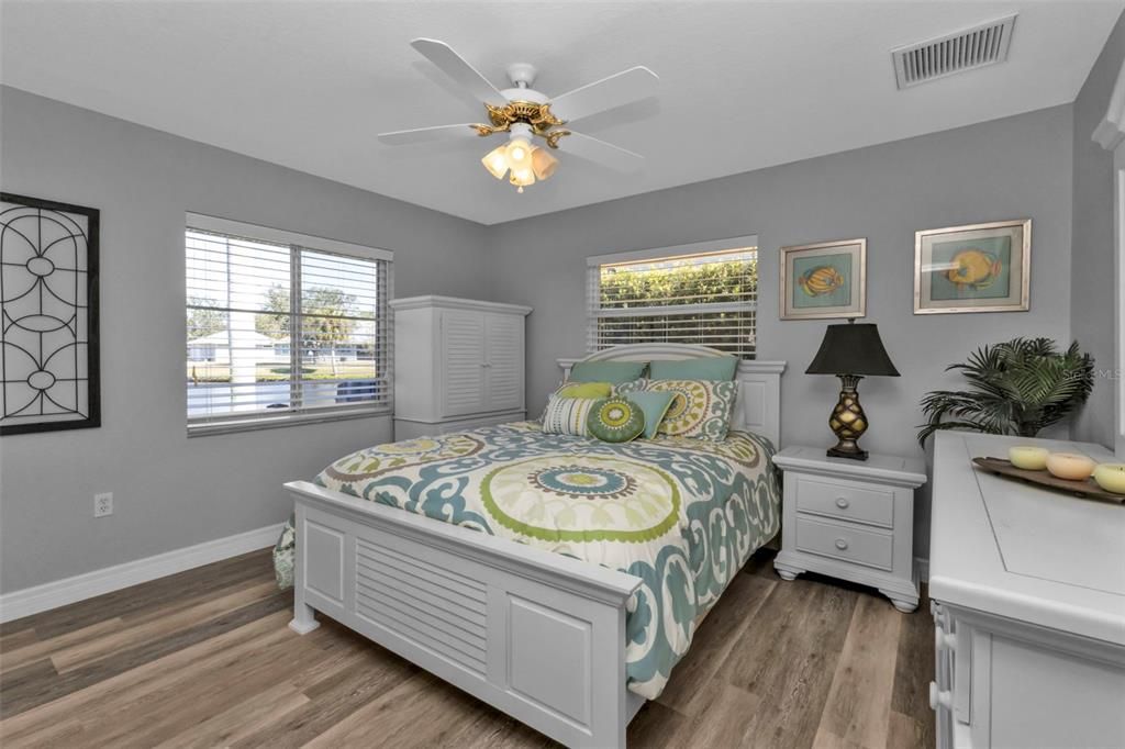 Bedroom 2 with luxury vinyl flooring and large reach in closet.