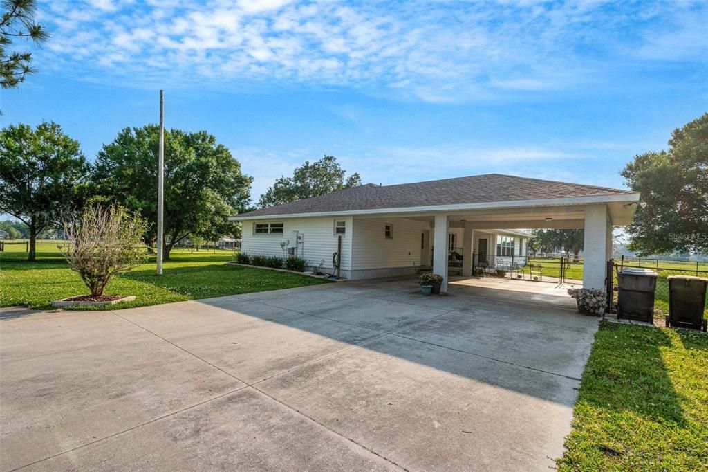 The oversized carport is deep enough to house larger SUV's and trucks while still allowing plenty of extra parking space.