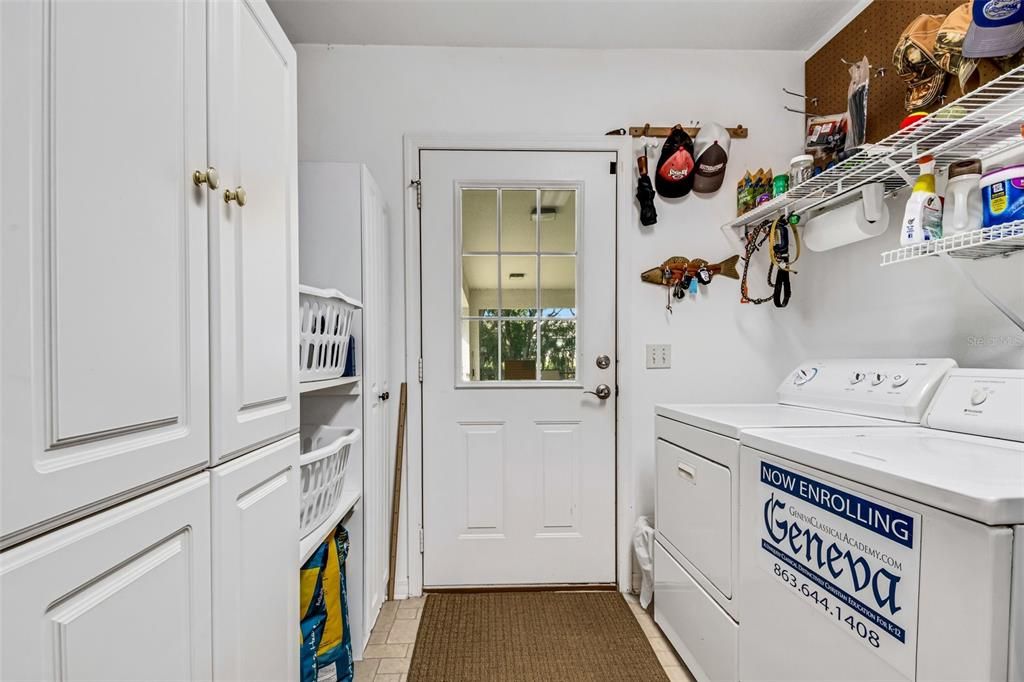 This side entrance comes in from the carport and is far more than space for the washer & dryer but also extra cabinets for storage and designed for efficient handling of laundry  . . .