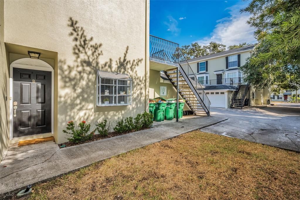 COMMUNITY GRASS AREA IN FRONT OF SIDE DECK AND FRONT DOOR