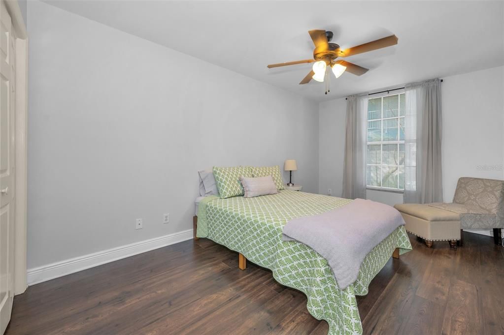 2nd Bedroom with window overlooking rear community green area.