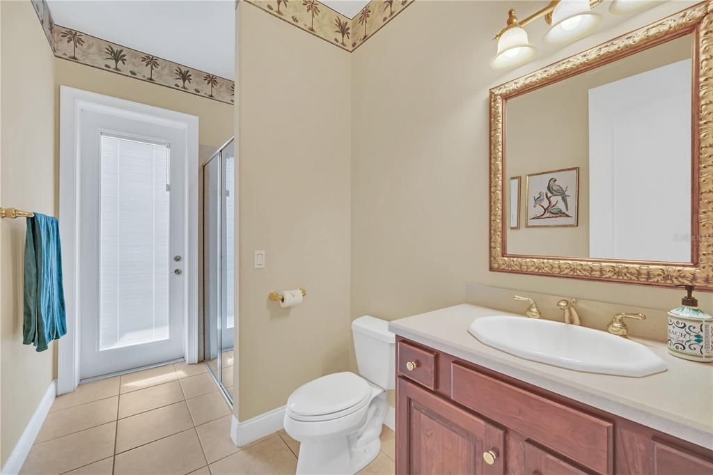 Full Bath Located on Main Level with entrance to pool/patio