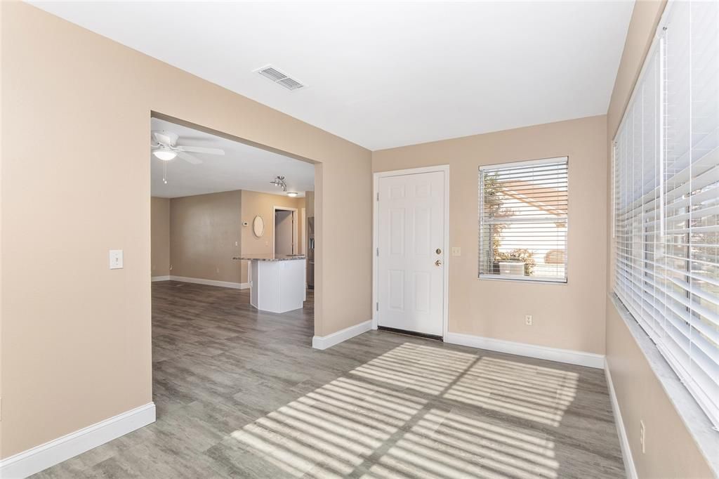 florida room with door leading to grilling area