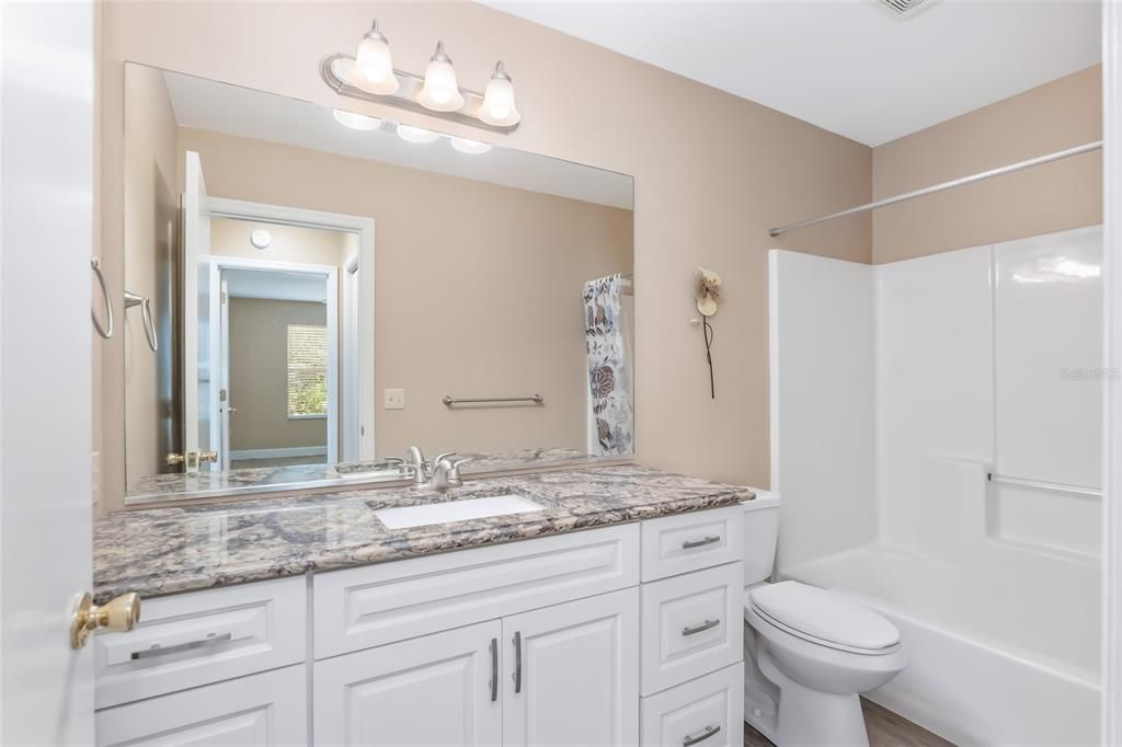 guest bathroom with tub  1