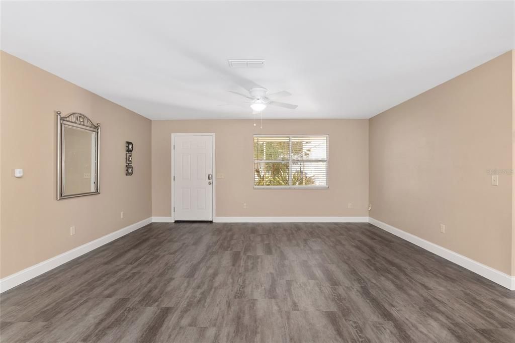 living room & dining room looking towards front door