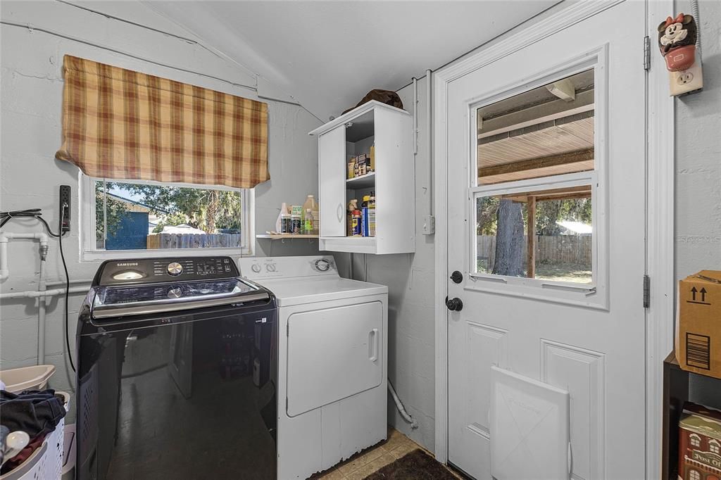 Inside laundry with door to back yard