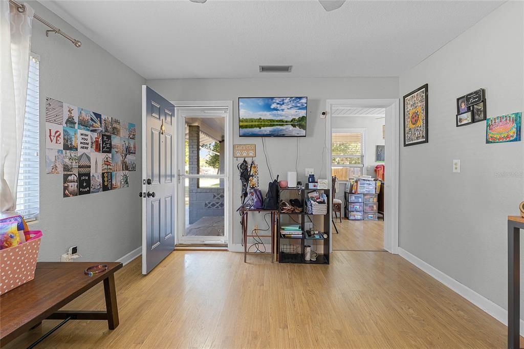 Entry door has storm door to allow additional light into the room