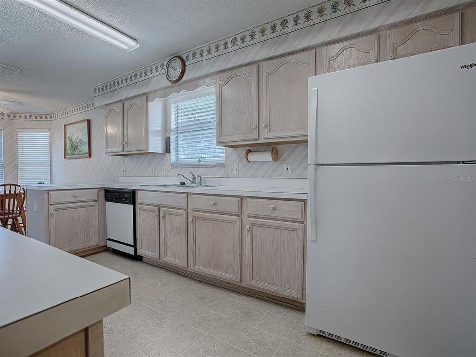 GALLEY KITCHEN WITH PLENTY OF CABINETS