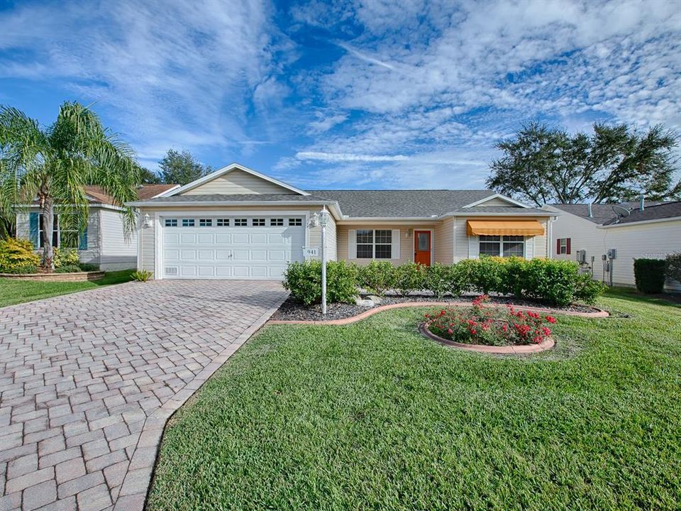 GORGEOUS LANDSCAPING, PAVERED DRIVEWAY AND PLENTY OF CURB APPEAL!