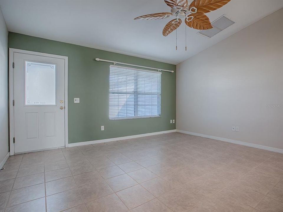 STEP INSIDE... NOTE THE UNIQUE CEILING FAN AND BEAUTIFUL TILE FLOORING