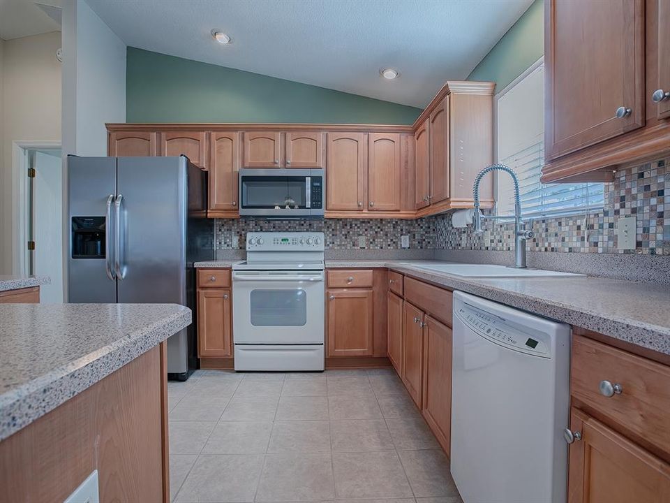 CHECK OUT THE BEAUTIFUL TILED BACKSPLASH AND SINK!