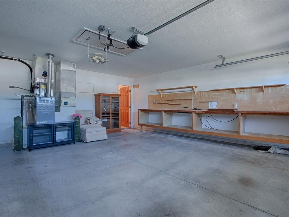 WORKSHOP AREA AND PULL-DOWN ATTIC STAIRS FOR EVEN MORE STORAGE SPACE