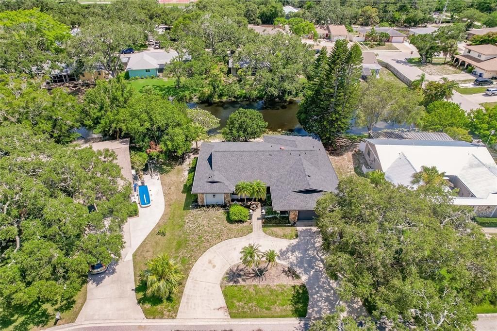 Aerial View of Home with Circular Driveway and Canal