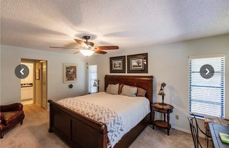 Large Master Bedroom with Master Bath to the Left that includes excellent shower area.  To the right are glass sliding doors that go to the Lanai.