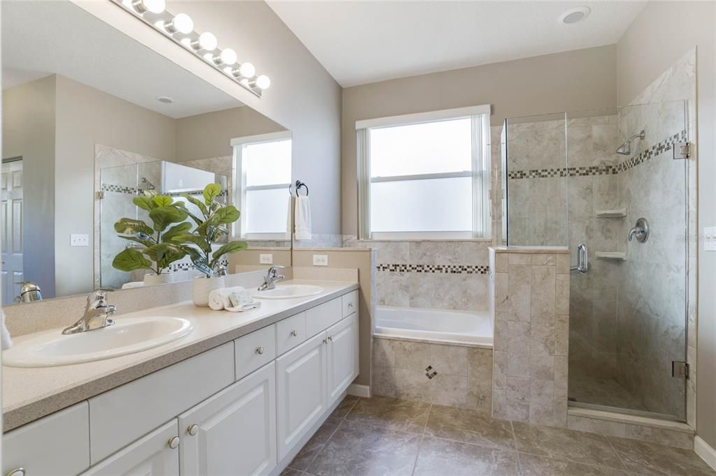 Primary Bathroom w/ soaking tub & frameless glass enclosed walk-in shower