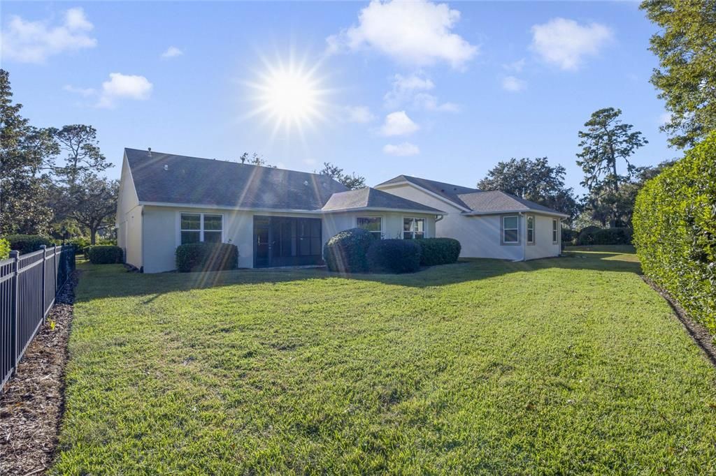 View of the rear of the home & backyard