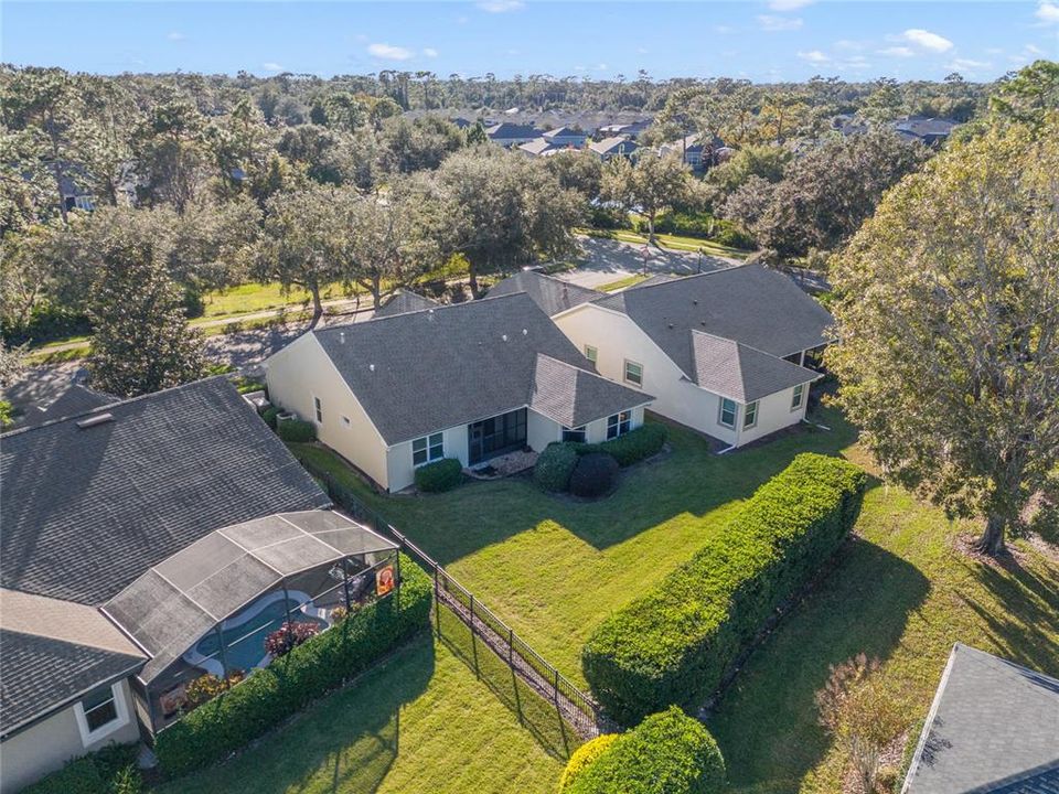 Aerial view of the rear of the home & backyard