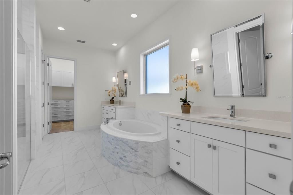 Primar Bathroom with Large Walkin Shower, double vanities, and soaking tub.