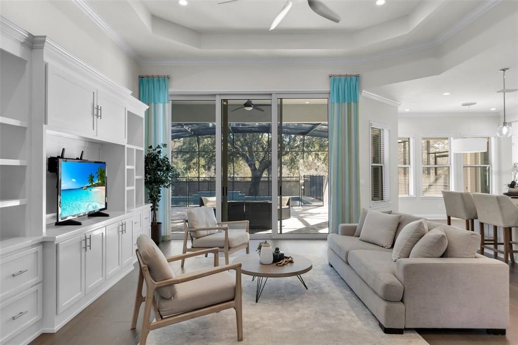 Spacious living room with 10ft sliders overlooking the pool.