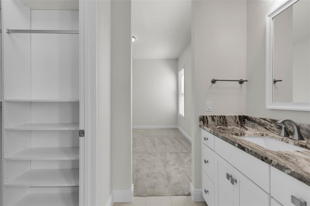 Jack and Jill Bathroom with California Closets