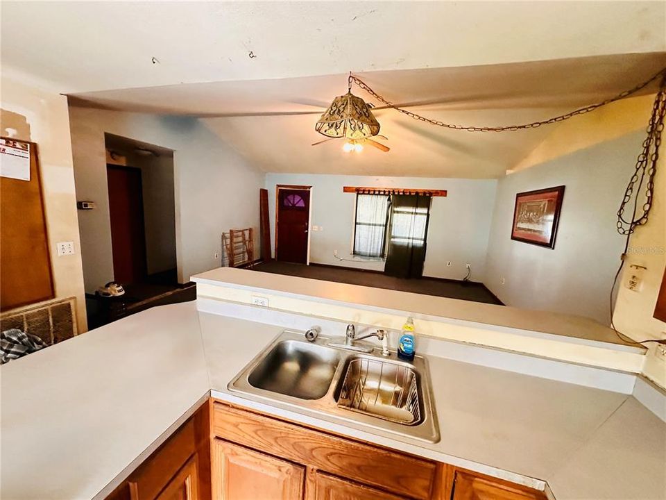 KITCHEN OPENS TO LIVING AREA