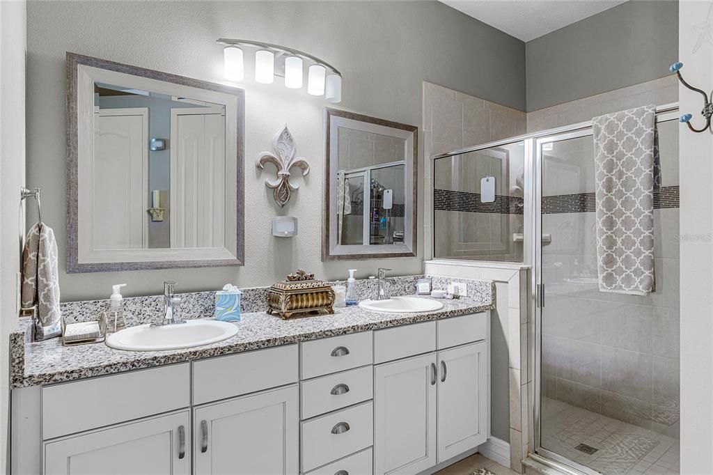 Primary bath with dual sinks and walk-in shower