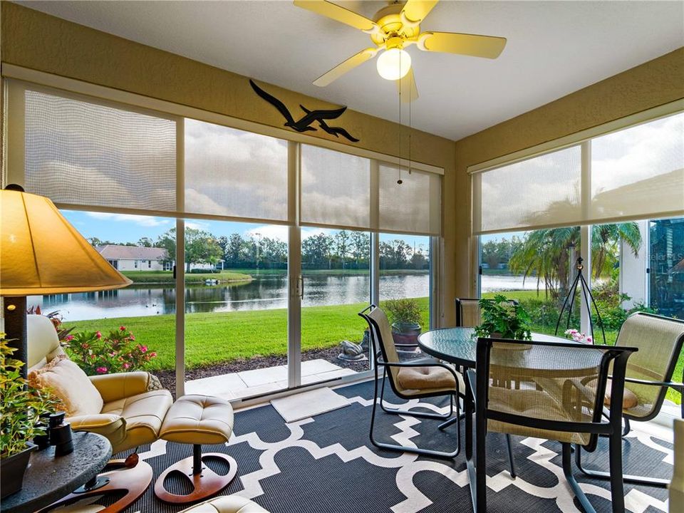 Step into this Charming Florida Lanai providing serine views of this Lake Front Home.  Dine Alfresco or just Relax and Enjoy the View.