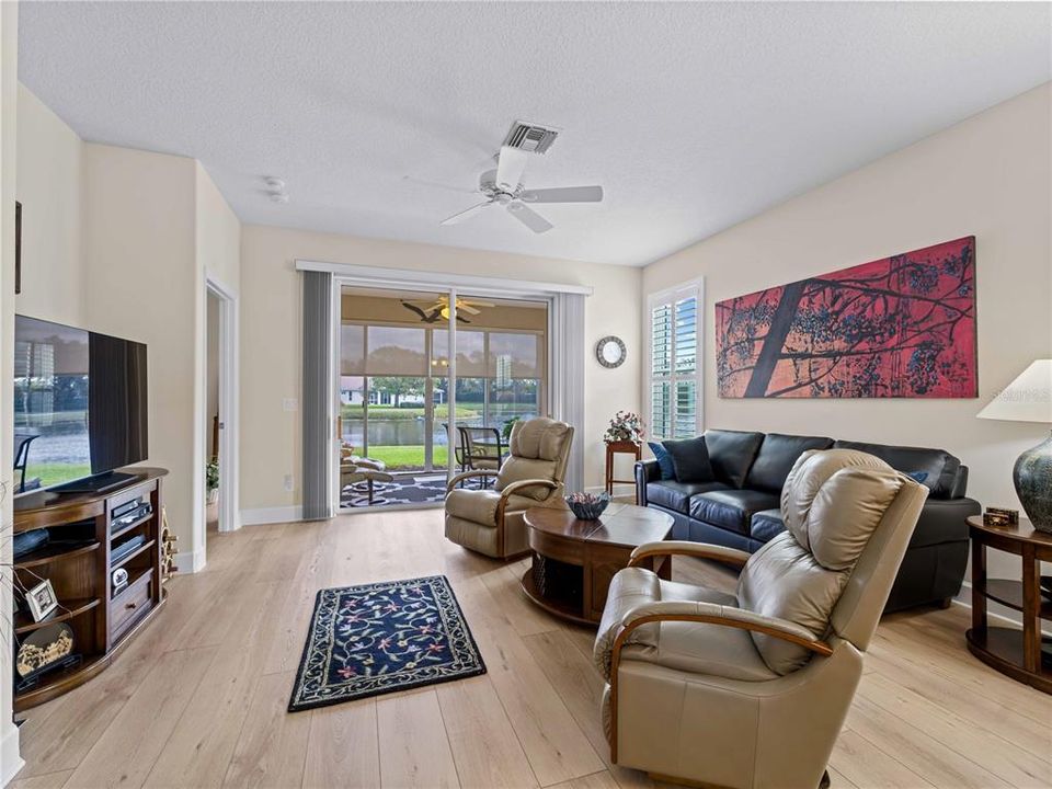 Open Living Room with large sliders leading to Lanai with Lake View.