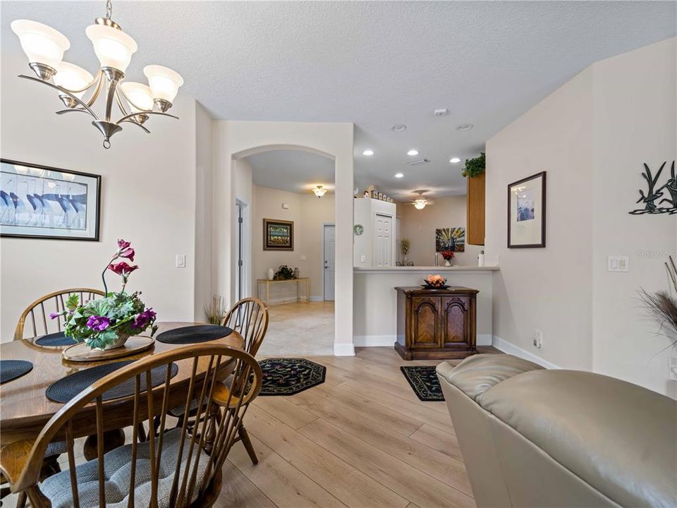 Dining Area close to the Kitchen. The Breakfast Bar currently utilized to house a cabinet.