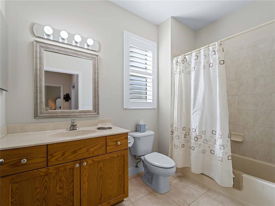 Second Bathroom with plantation shutters.