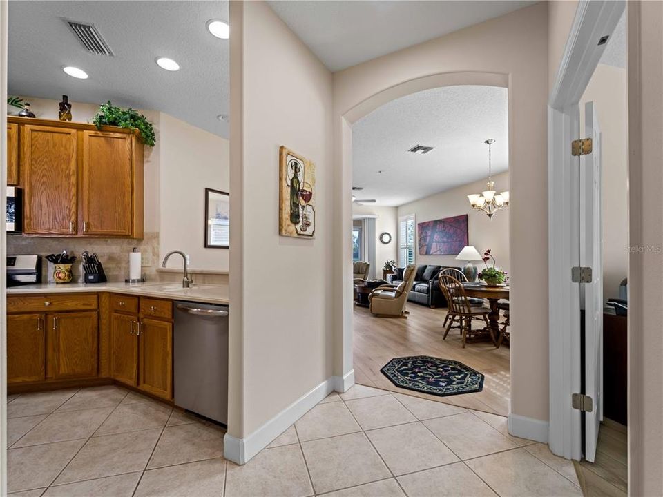 Kitchen open to Dining Area with Breakfast Bar and View of Lake.