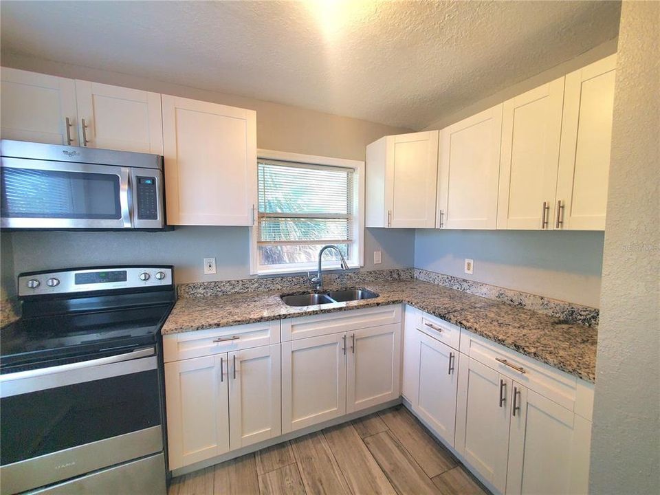 Wow! Granite Countertops and Stainless Steel Appliances