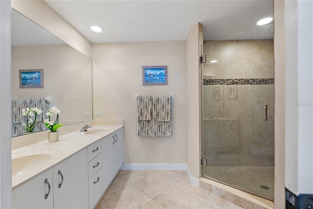 Primary bathroom suite with double vanity and great walk-in shower