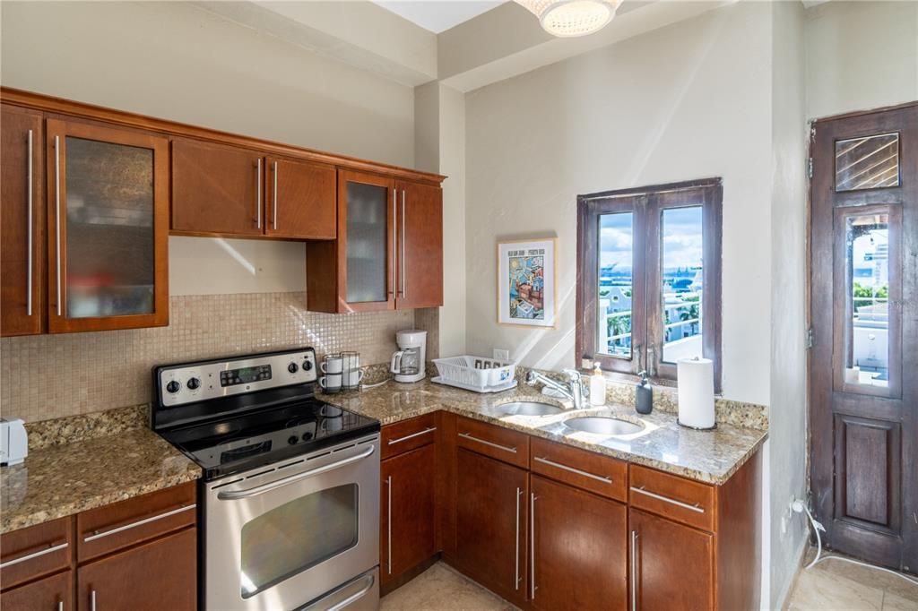 Kitchen with windows facing terrace