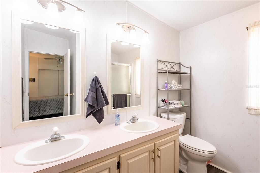 Master bathroom showing dual vanity sinks.