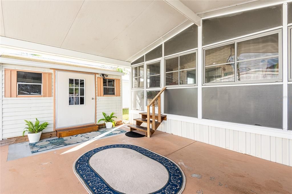 Carport and side entrance - great shed for storage on left