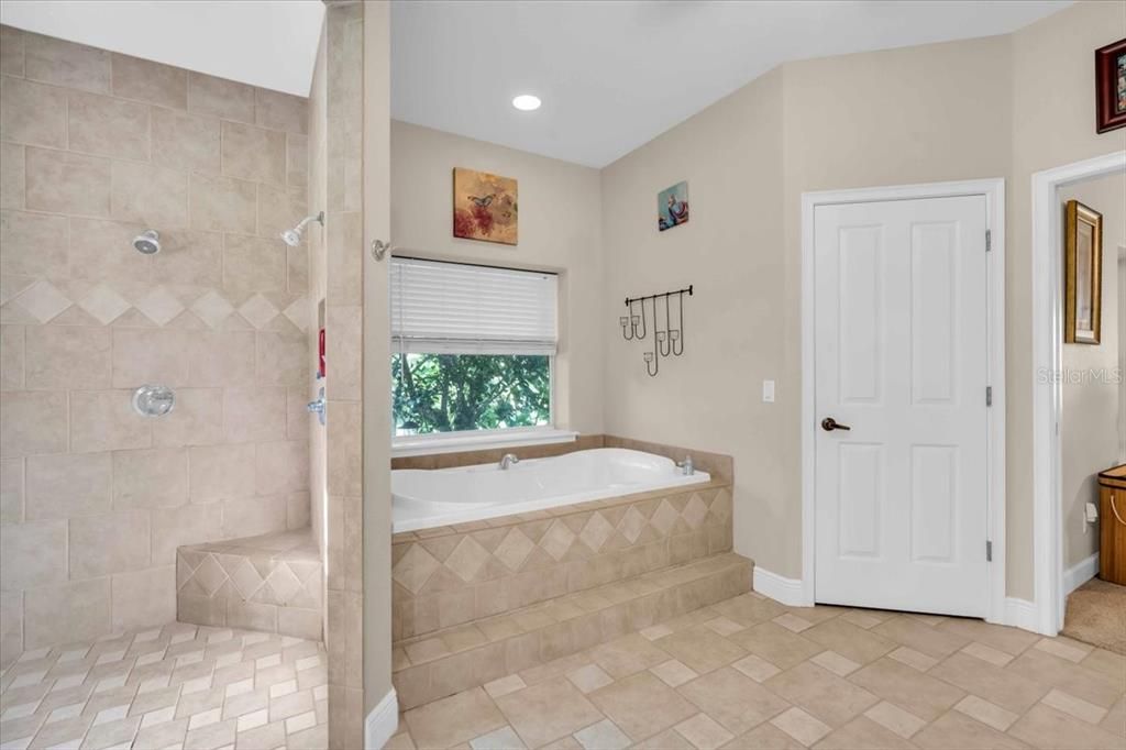 Tiled Primary Bathroom | Full En Suite | Largest Walk-In Owner's Closet of Main Residence at Tall Palms Ranch