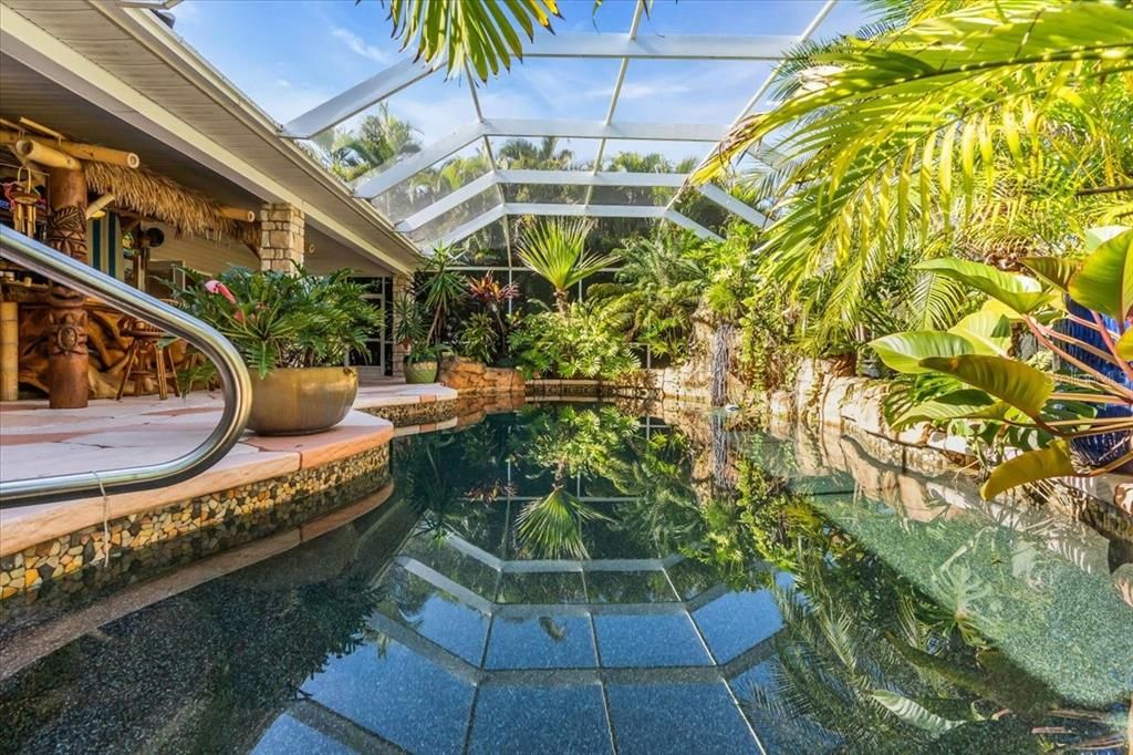 Even has a waterfall amongst the Pool on the lanai of Main Residence at Tall Palms Ranch