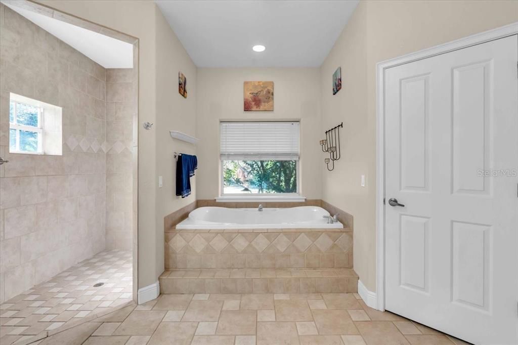 Primary Bathroom with Walk-in Shower, soaking tub and toilet closet of Main Residence at Tall Palms Ranch