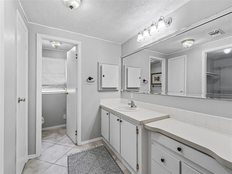 Roomy primary bathroom with separate shower area