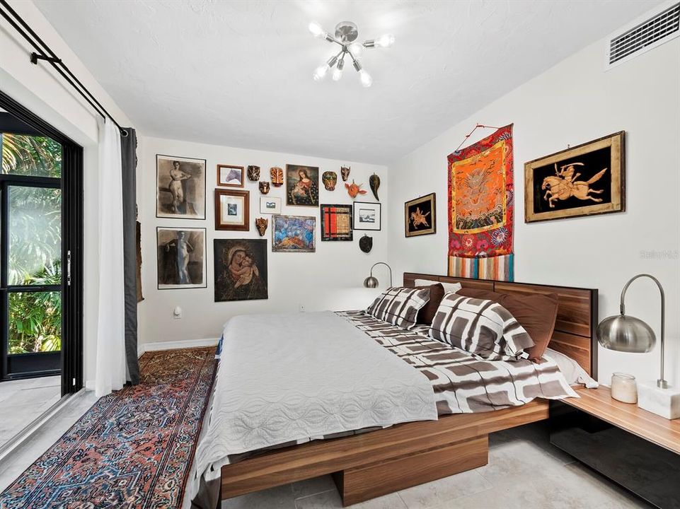 One guest bedroom leads to the sparkling heated salt-water pool.